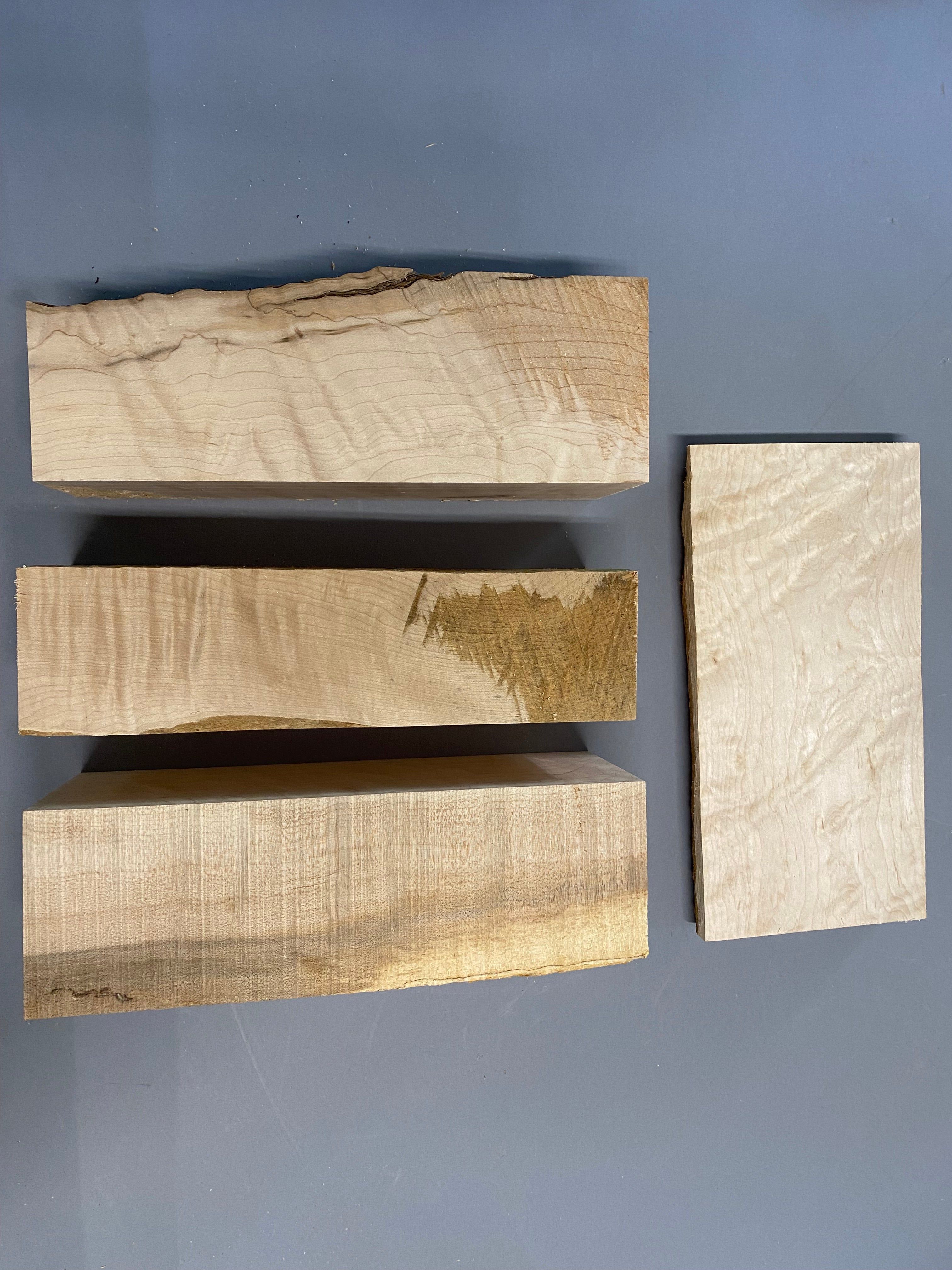 16/4 birdseye maple turning blanks with a 12/4 curly maple blank in a large flat rate box