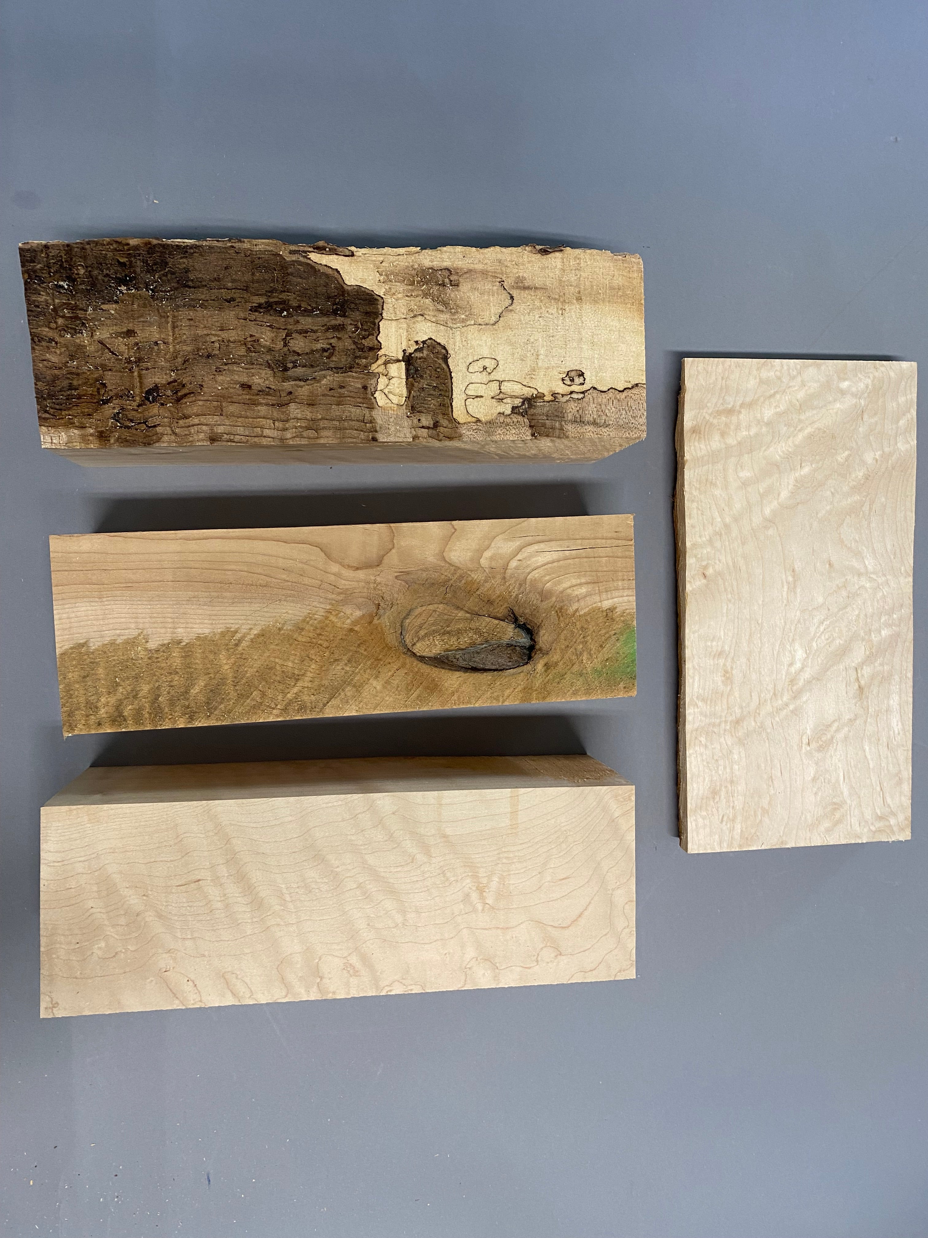 16/4 birdseye maple turning blanks with a 12/4 curly maple blank in a large flat rate box