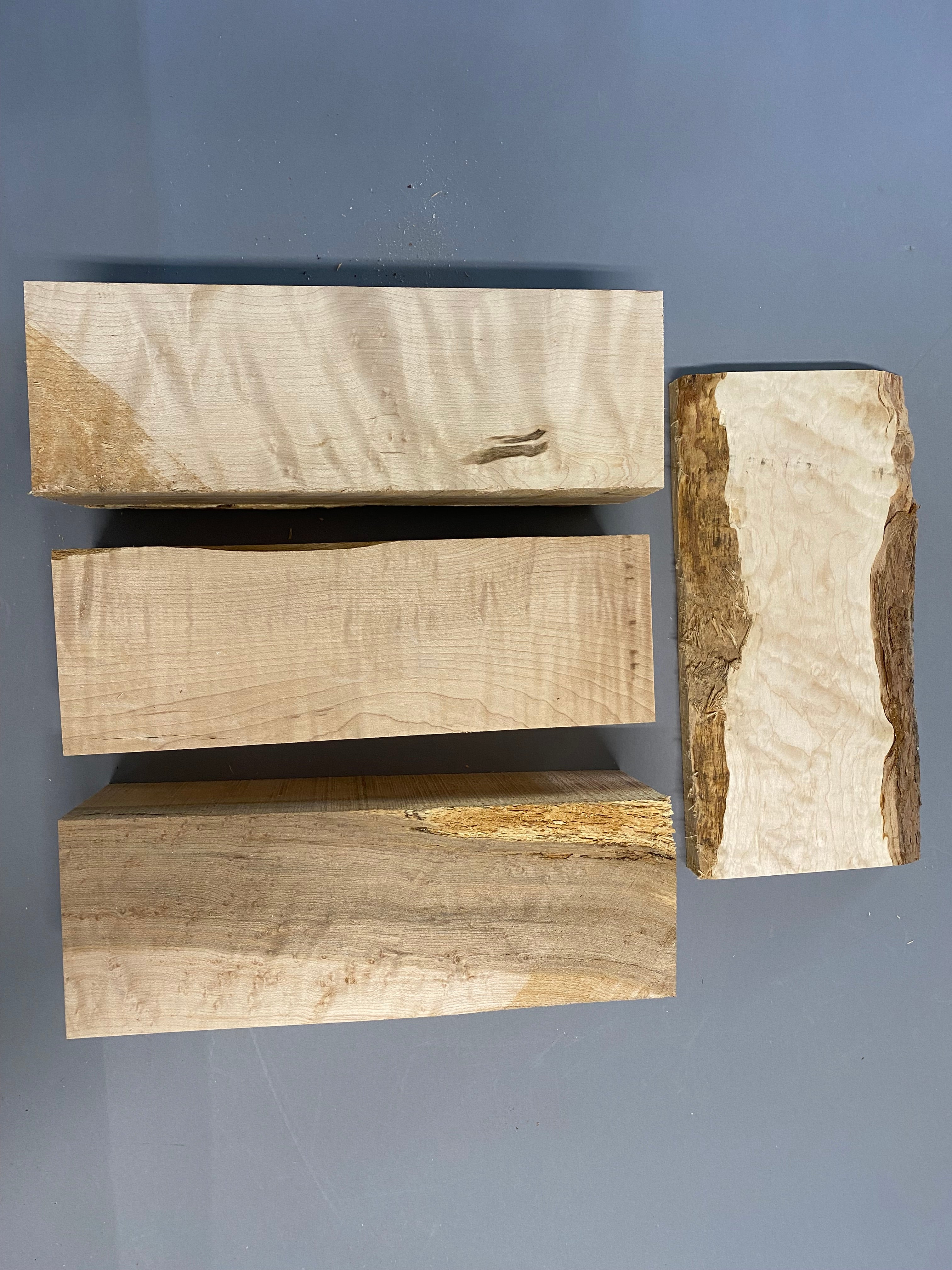 16/4 birdseye maple turning blanks with a 12/4 curly maple blank in a large flat rate box