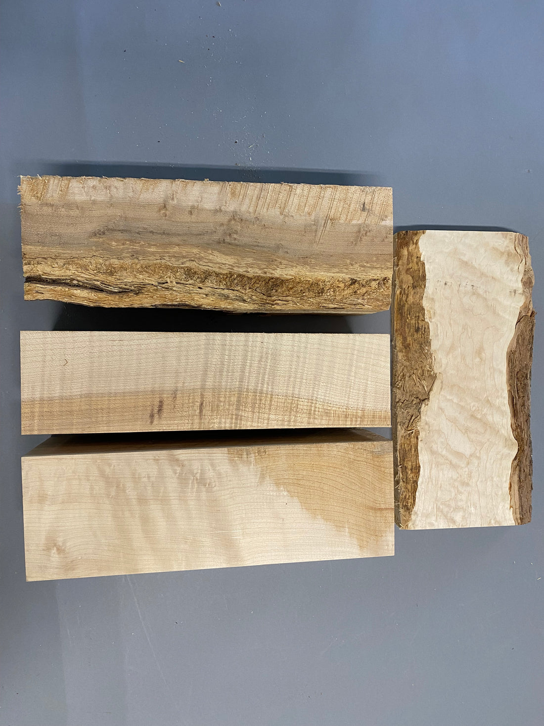 16/4 birdseye maple turning blanks with a 12/4 curly maple blank in a large flat rate box